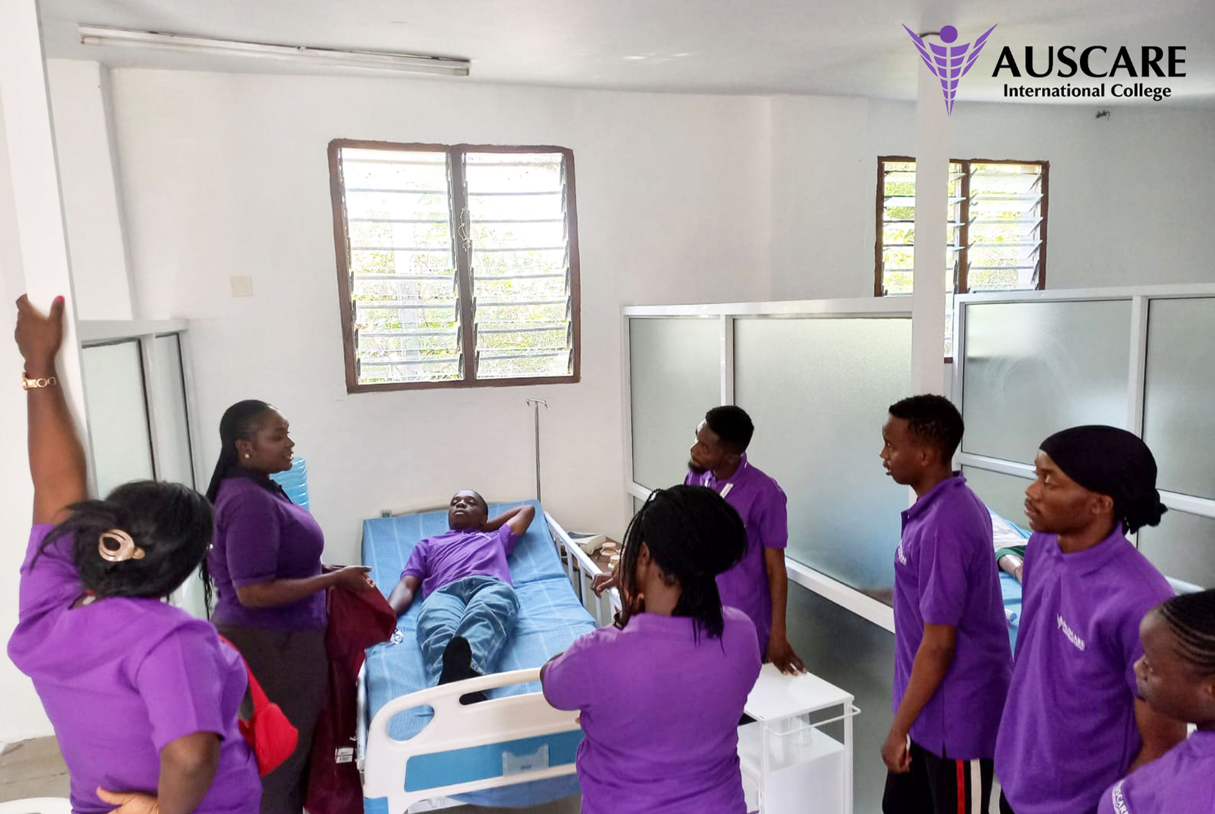 Students in deep violet purple nursing scrubs at Auscare International College — best nursing college in Mombasa